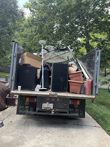 Junk removal truck in action image JunkUp Junk Removal Falls church